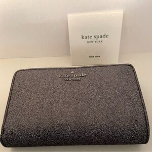 Kate Spade Lola Bi-fold Glitter Fabric Wallet. Snap closure with zipper pockets.